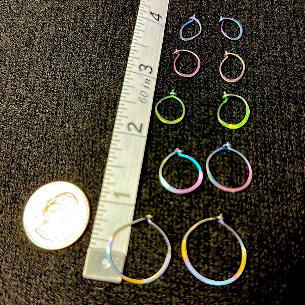 5 pair of dichroic rainbow hoop earrings in different sizes. hippie, boho vibes